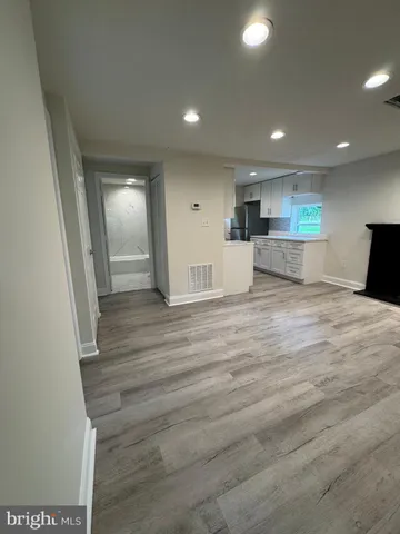 a view of kitchen with wooden floor