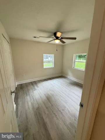 an empty room with wooden door