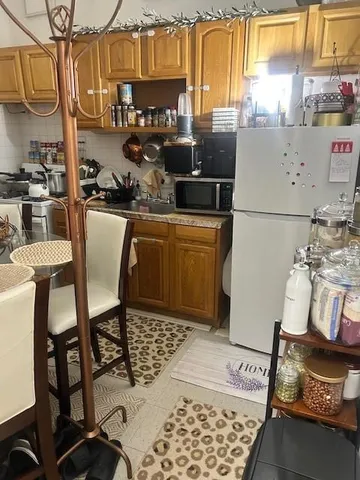a kitchen with a sink a stove and a table