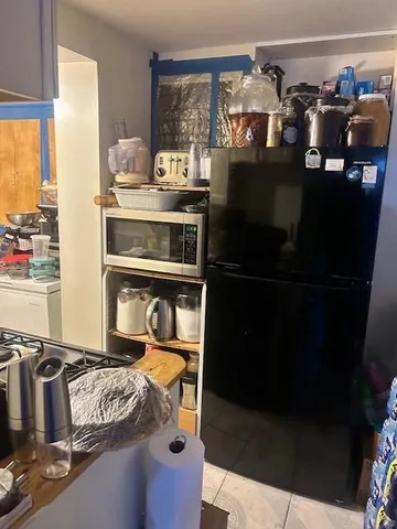 a kitchen with a stove and a refrigerator