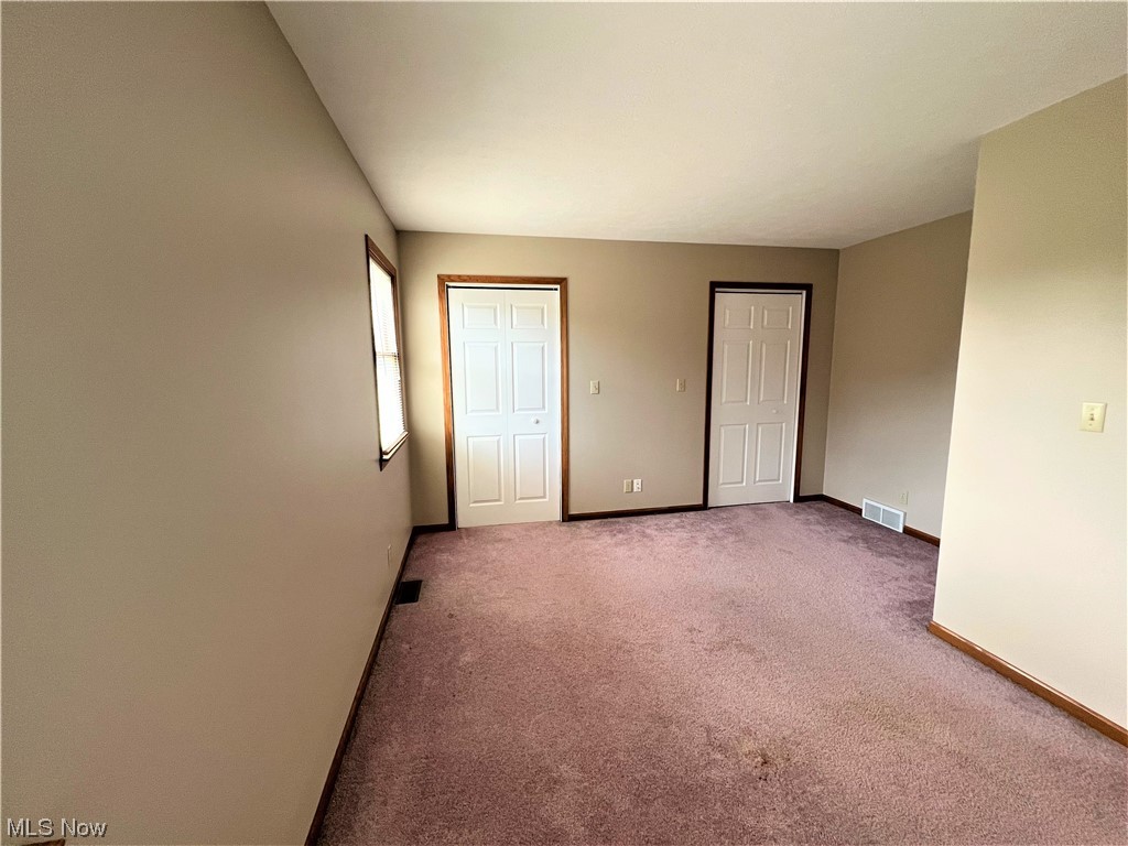 607 Bryan Road Milan, OH 44846 - Photo 16 of 34 View of carpeted empty room