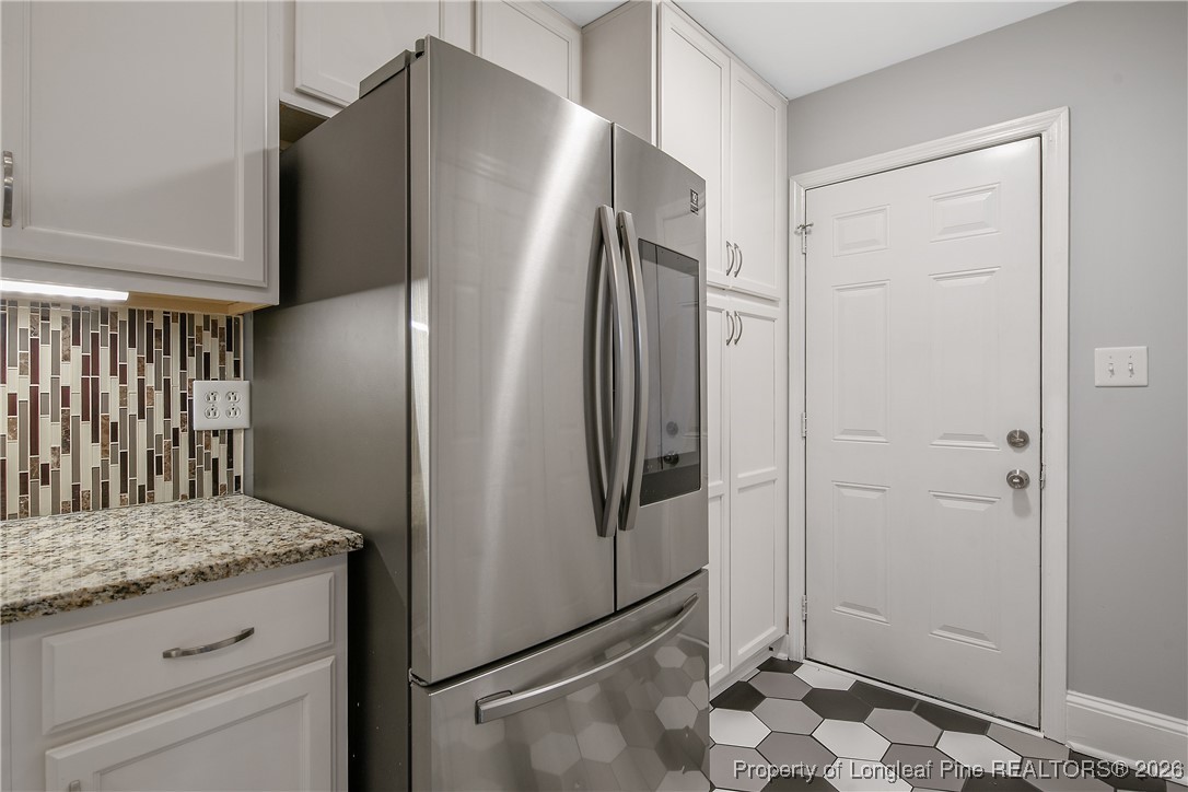 1915 Morganton Road Fayetteville, NC 28305 - Photo 16 of 48 a kitchen with stainless steel appliances granite countertop a refrigerator and a sink