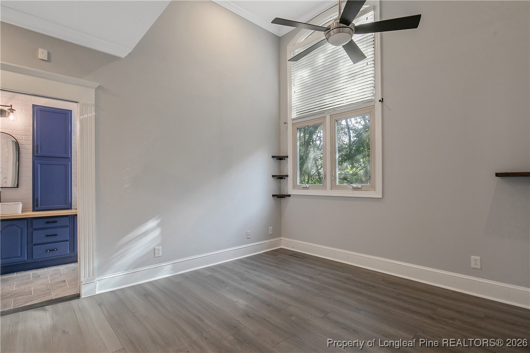 1915 Morganton Road Fayetteville, NC 28305 - Photo 19 of 48 wooden floor in an empty room with a window