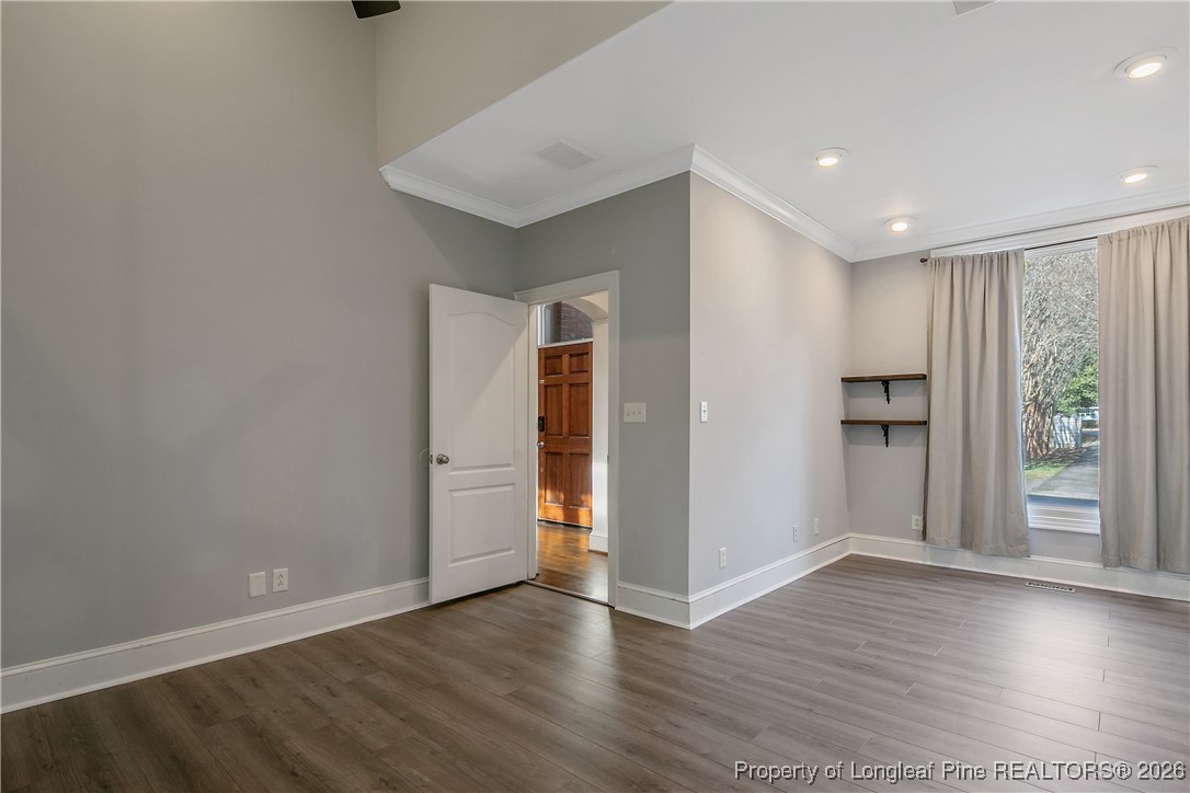 1915 Morganton Road Fayetteville, NC 28305 - Photo 21 of 48 a view of an empty room with wooden floor and a window