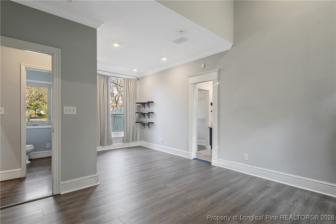 1915 Morganton Road Fayetteville, NC 28305 - Photo 22 of 48 wooden floor in an empty room with a window