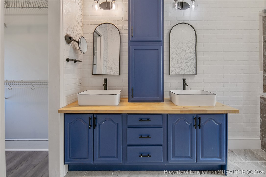 1915 Morganton Road Fayetteville, NC 28305 - Photo 23 of 48 a bathroom with a sink and a mirror