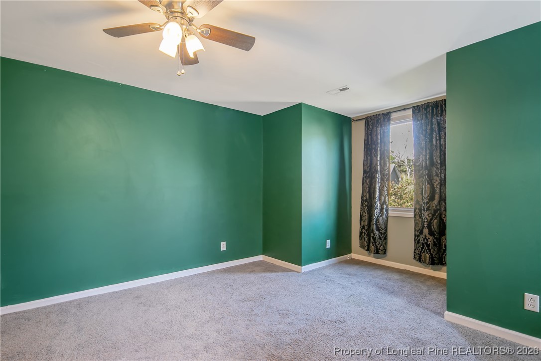 1915 Morganton Road Fayetteville, NC 28305 - Photo 38 of 48 an empty room with closet and fan