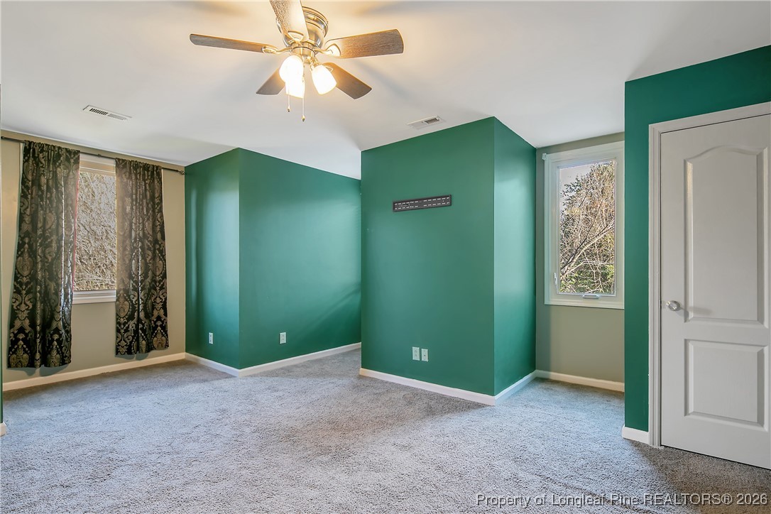 1915 Morganton Road Fayetteville, NC 28305 - Photo 39 of 48 an empty room with closet and fan