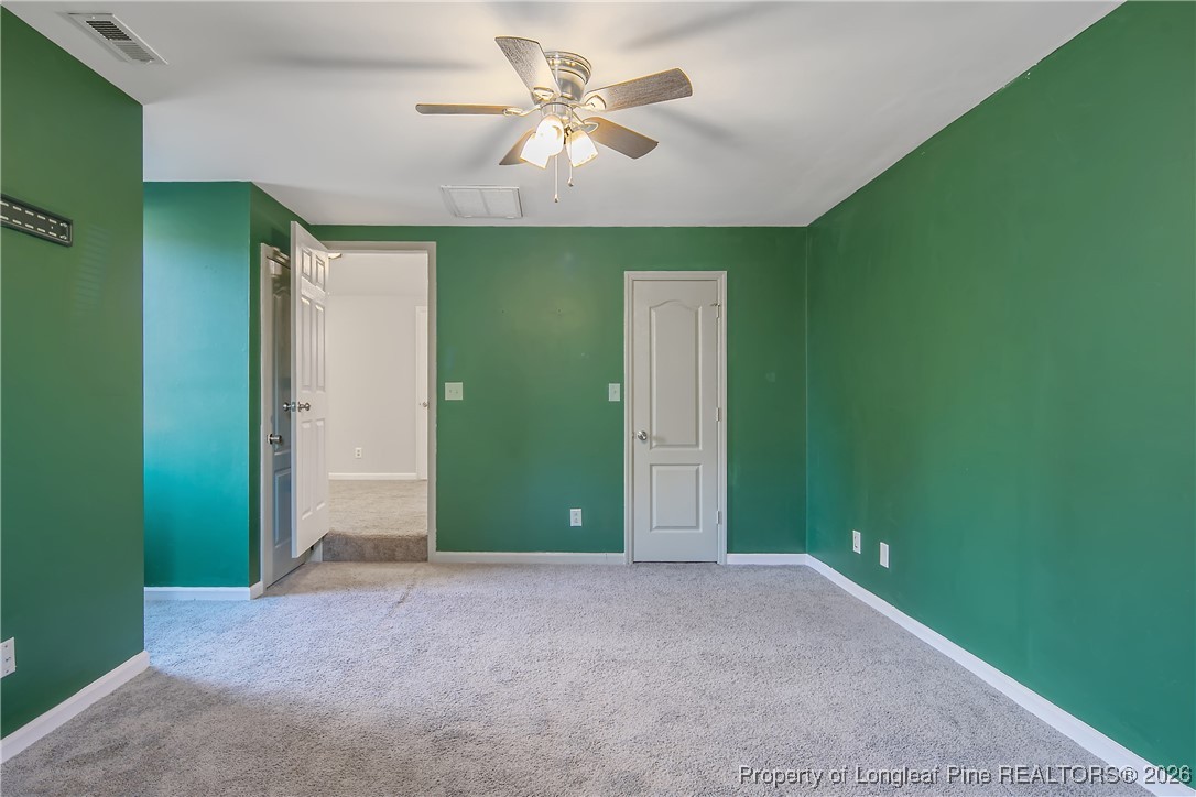 1915 Morganton Road Fayetteville, NC 28305 - Photo 40 of 48 an empty room with closet and fan