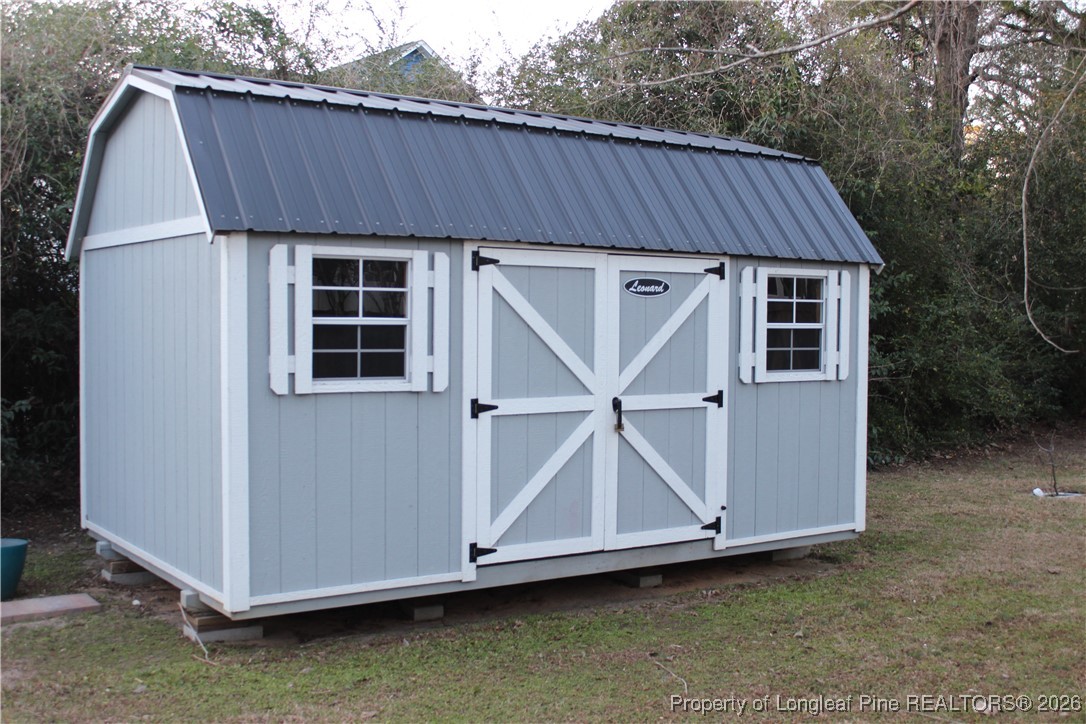 1915 Morganton Road Fayetteville, NC 28305 - Photo 42 of 48 a view of a house with backyard and deck