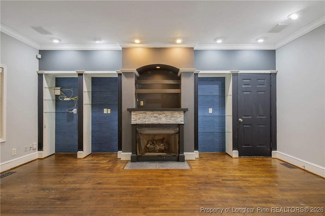 1915 Morganton Road Fayetteville, NC 28305 - Photo 7 of 48 a view of an empty room with a fireplace