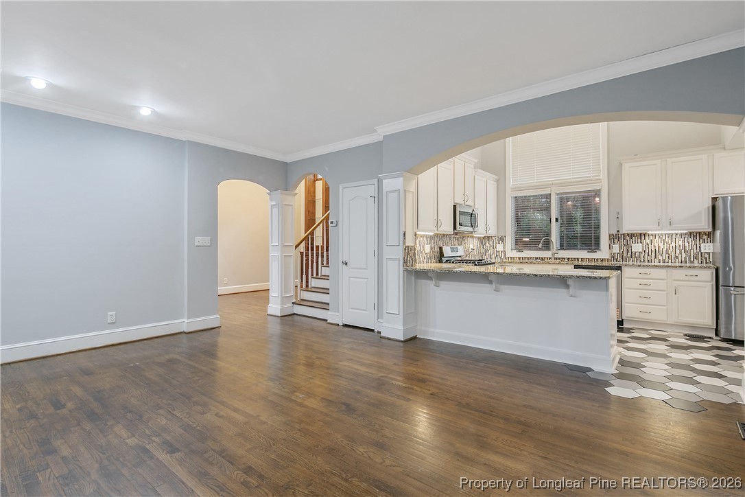 1915 Morganton Road Fayetteville, NC 28305 - Photo 9 of 48 a kitchen with stainless steel appliances granite countertop a refrigerator sink and cabinets