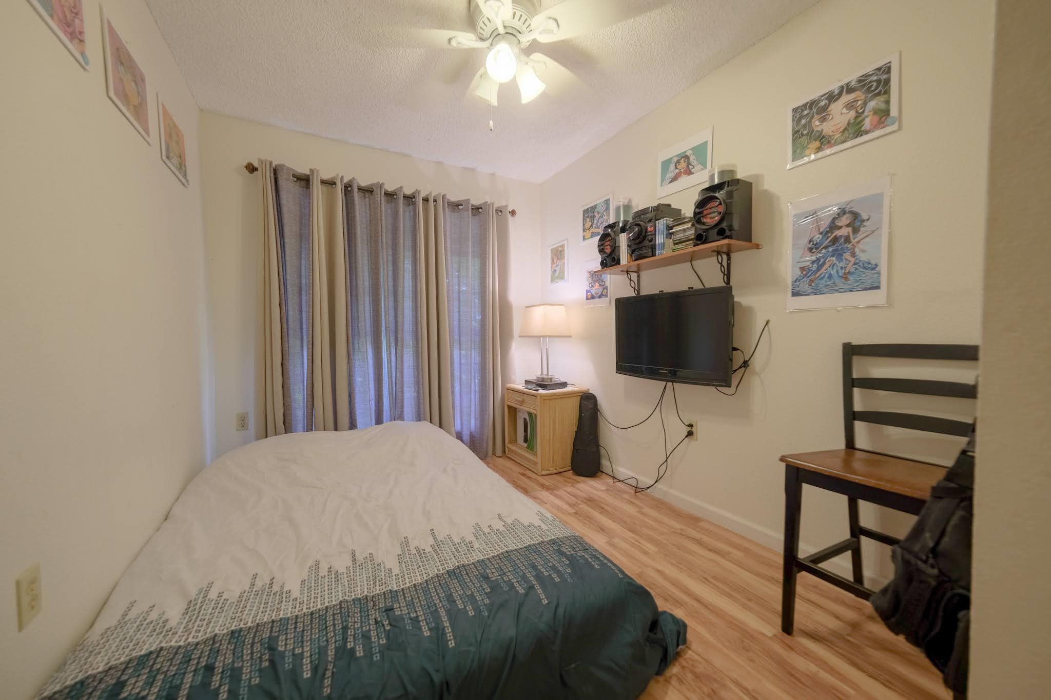 160 Keonekai Road, Unit 13206 Kihei, HI 96753 - Photo 11 of 14 a bedroom with a bed and a flat screen tv