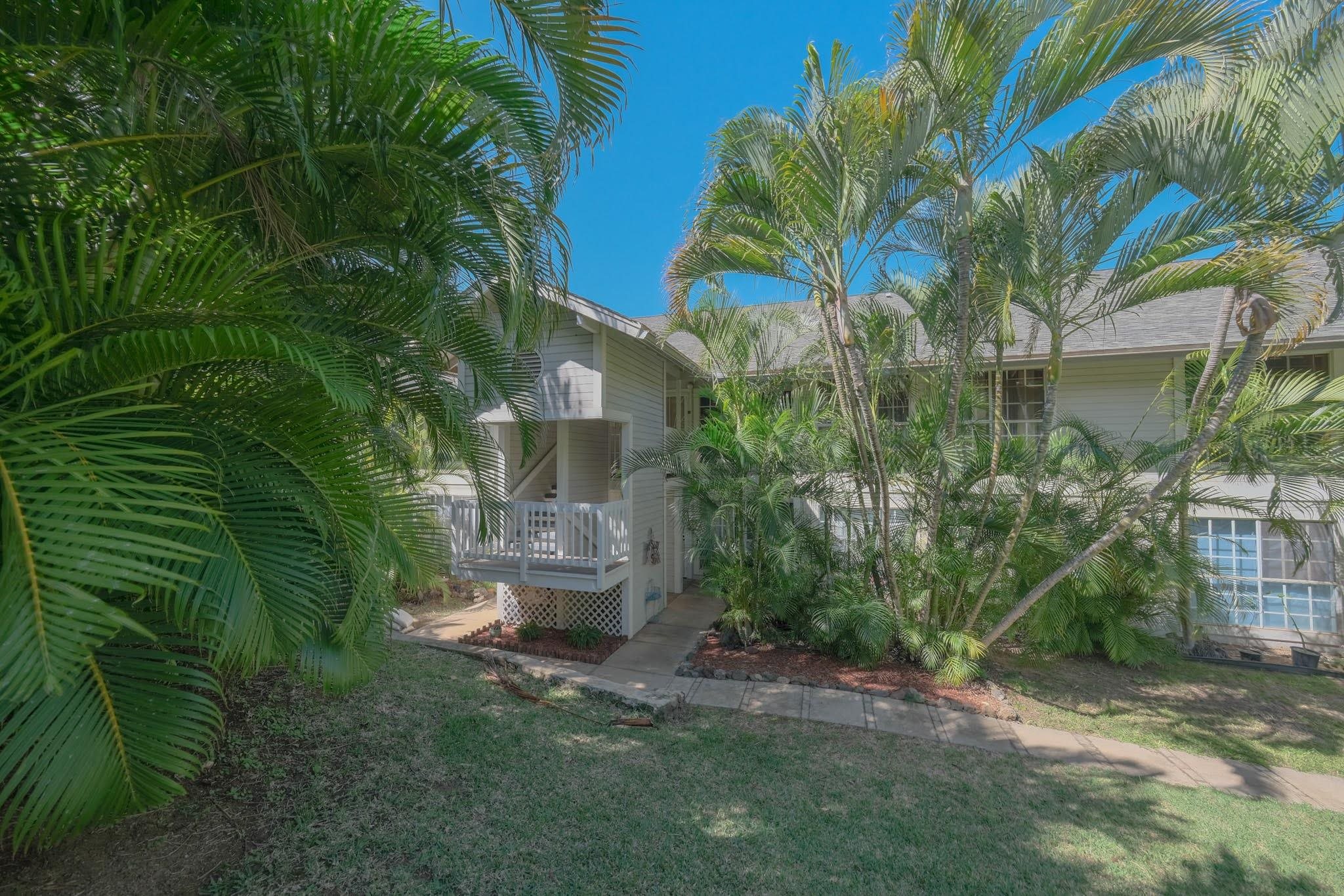 160 Keonekai Road, Unit 13206 Kihei, HI 96753 - Photo 2 of 14 a view of a backyard with plants and a fountain