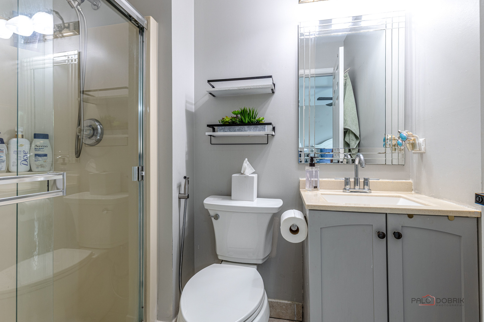 2627 Rutland Road Naperville, IL 60564 - Photo 19 of 38 a bathroom with a toilet a sink and shower