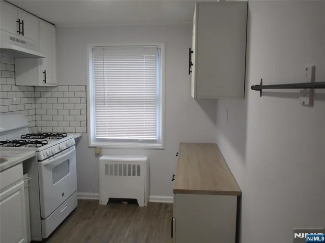 a kitchen with a sink and a stove