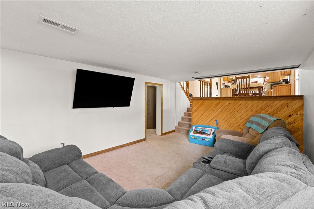 3223 Sandy Lake Road Ravenna, OH 44266 - Photo 18 of 30 Living room with light colored carpet