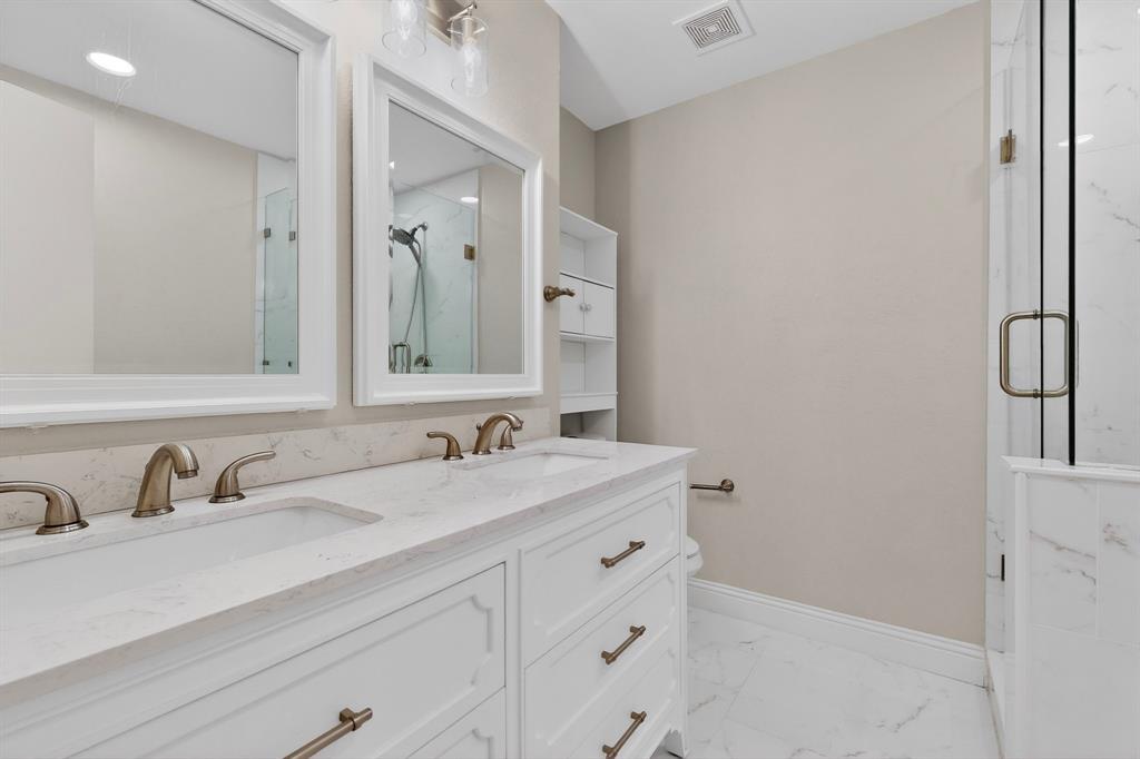 7729 Misty Ridge Drive North Fort Worth, TX 76137 - Photo 14 of 30 a bathroom with a sink and a mirror