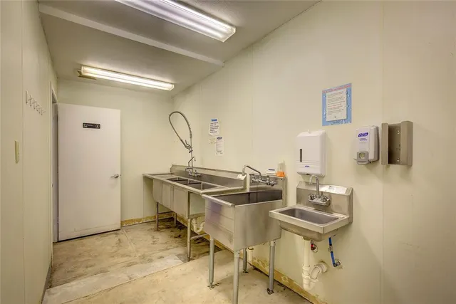 a dining room with table chairs and wooden floor