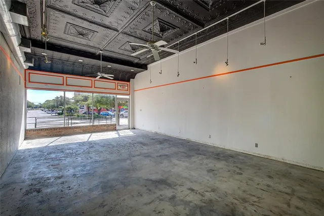 a view of room with wooden floor