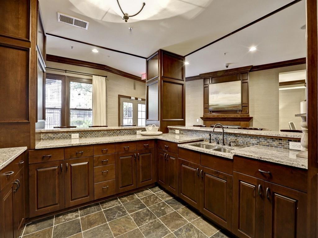 901 Abernathy Road Northeast, Unit 3200 Atlanta, GA 30328 - Photo 12 of 17 a bathroom with a sink double vanity granite and a mirror