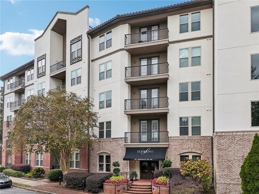 901 Abernathy Road Northeast, Unit 3200 Atlanta, GA 30328 - Photo 16 of 17 a front view of a building with parking space
