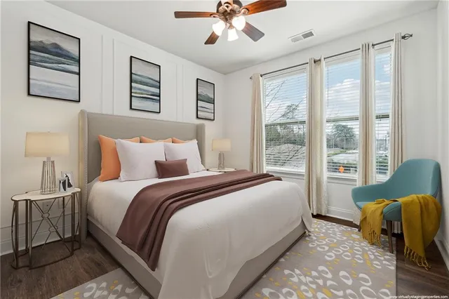 a bedroom with bed and glass windows