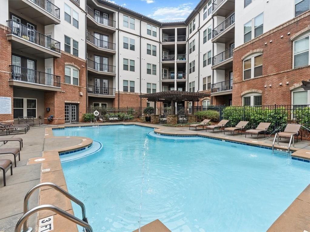 901 Abernathy Road Northeast, Unit 3200 Atlanta, GA 30328 - Photo 7 of 17 a view of pool with outdoor seating