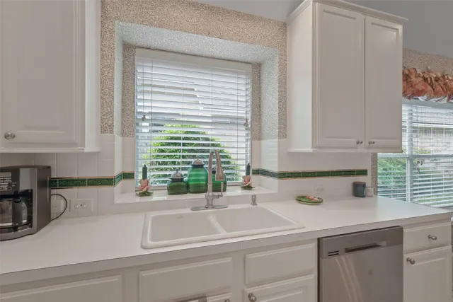 a kitchen with a sink and a window