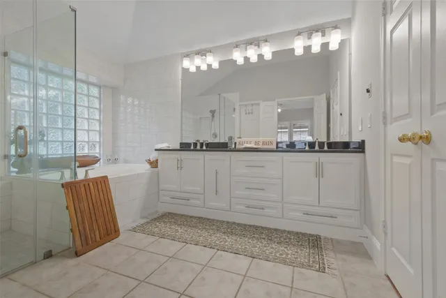 a bathroom with a sink a vanity and a mirror