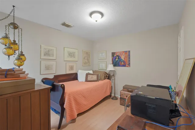 a bedroom with a bed and furniture