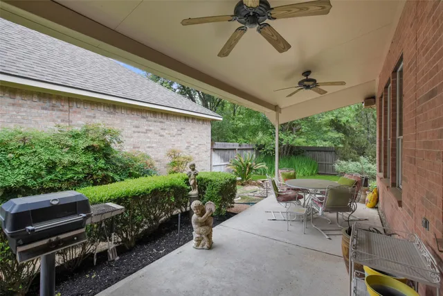a view of a porch with furniture and garden