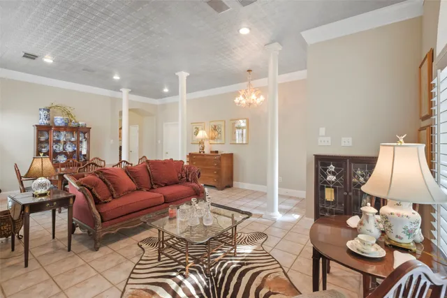a living room with furniture and a lamp