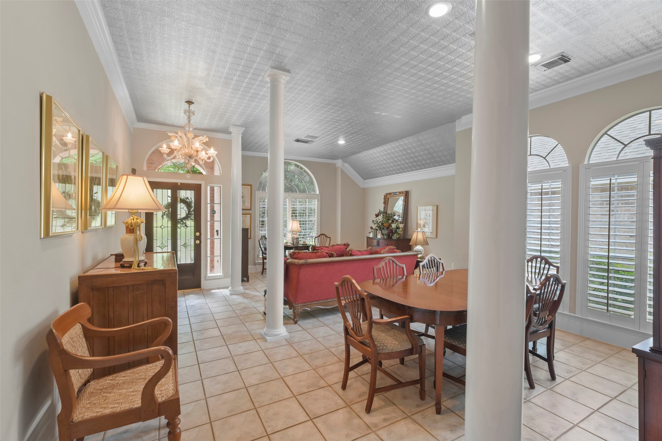 18 Pinery Ridge Place Spring, TX 77382 - Photo 9 of 38 a view of a dining room with furniture a chandelier and wooden floor