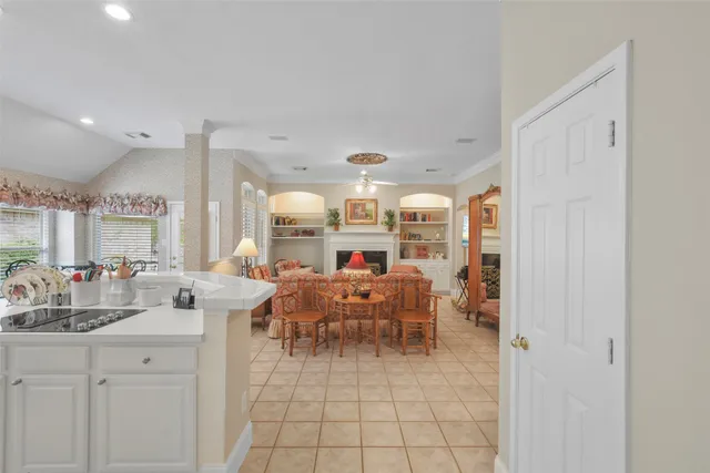 a very nice looking room with a large window and furniture