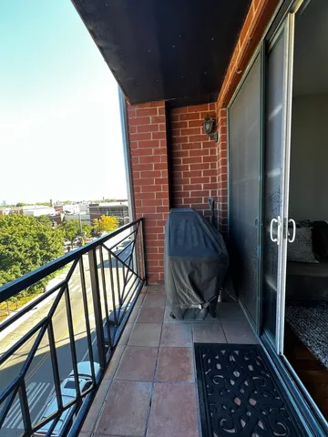 a view of a balcony with furniture