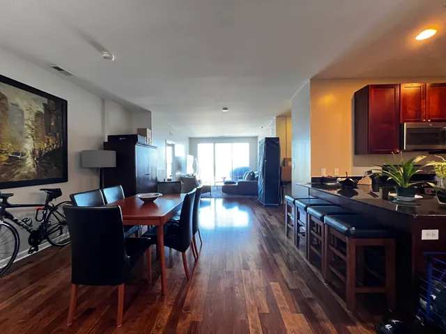a view of a dining room with furniture window and wooden floor