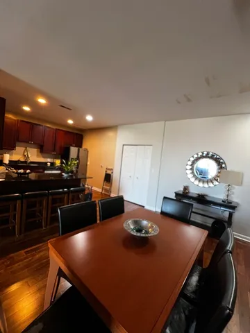 a kitchen with a table chairs stove and microwave