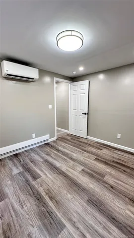 a view of a livingroom with wooden floor