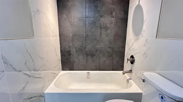 a bathroom with a sink and a bathtub