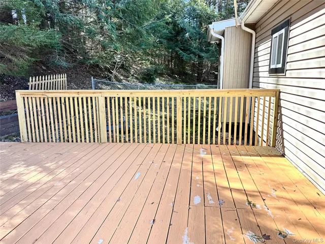 a balcony with wooden floor