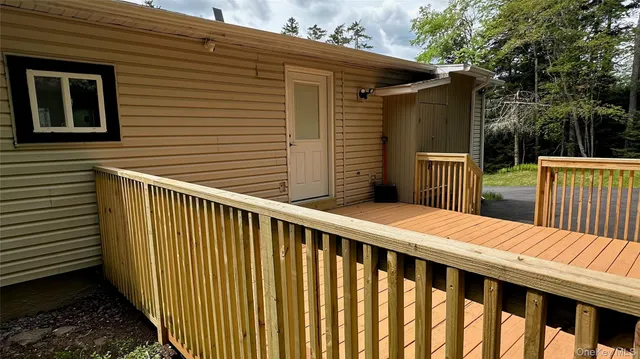 a balcony view with a backyard space