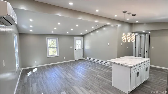 a bathroom with a sink vanity and a mirror