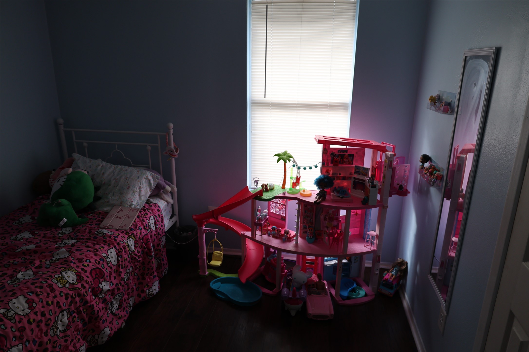 1009 Caplin Street Houston, TX 77022 - Photo 14 of 24 a bed sitting in a bedroom next to a window