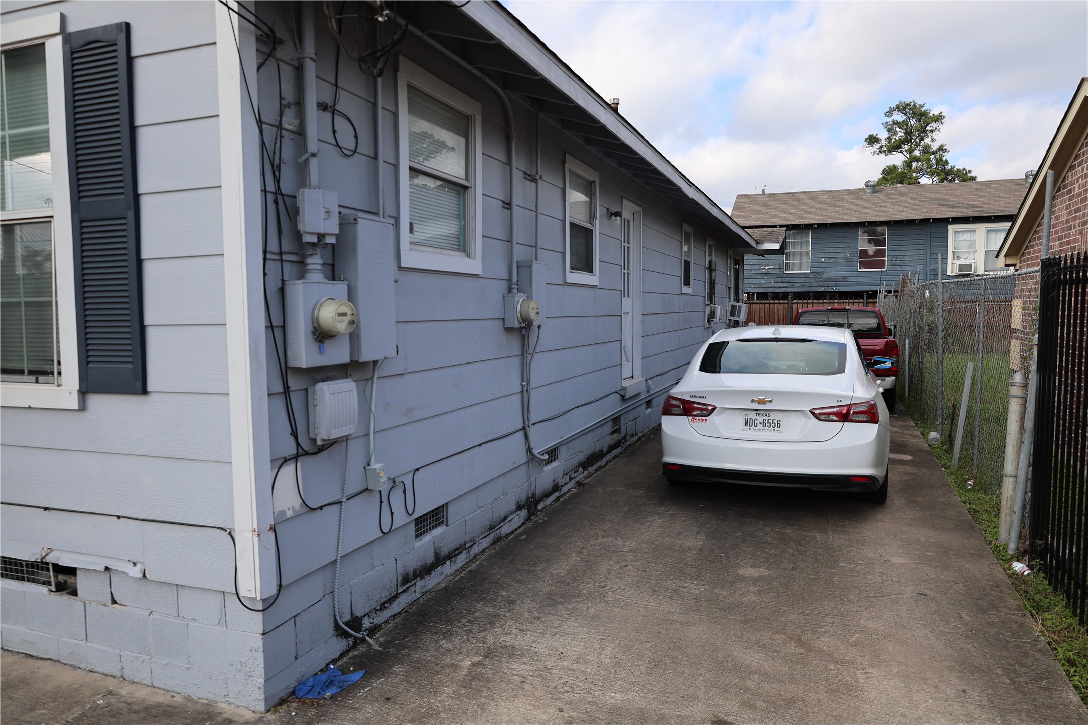1009 Caplin Street Houston, TX 77022 - Photo 17 of 24 a car parked in front of a building