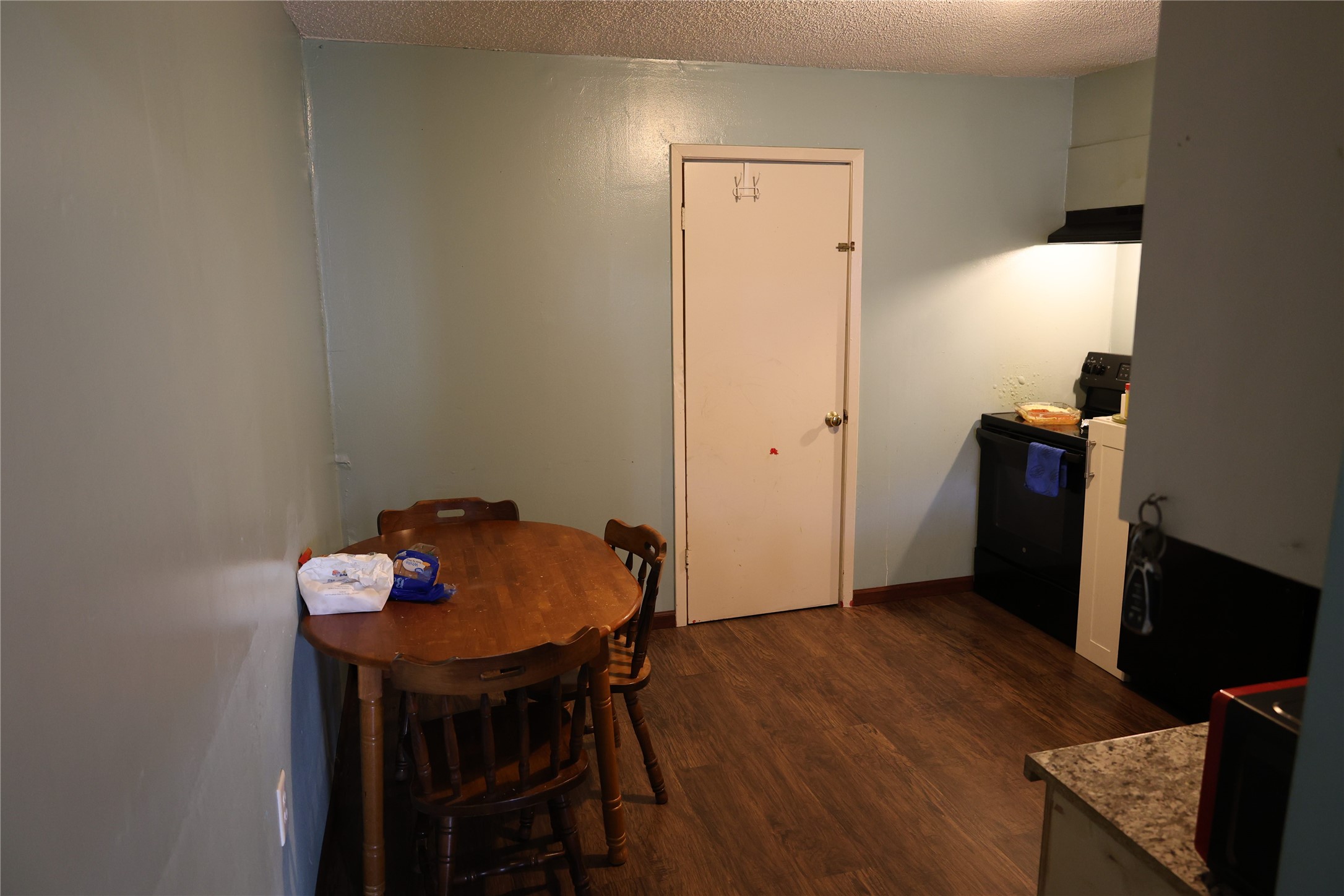 1009 Caplin Street Houston, TX 77022 - Photo 18 of 24 a view of a workspace with furniture and wooden floor