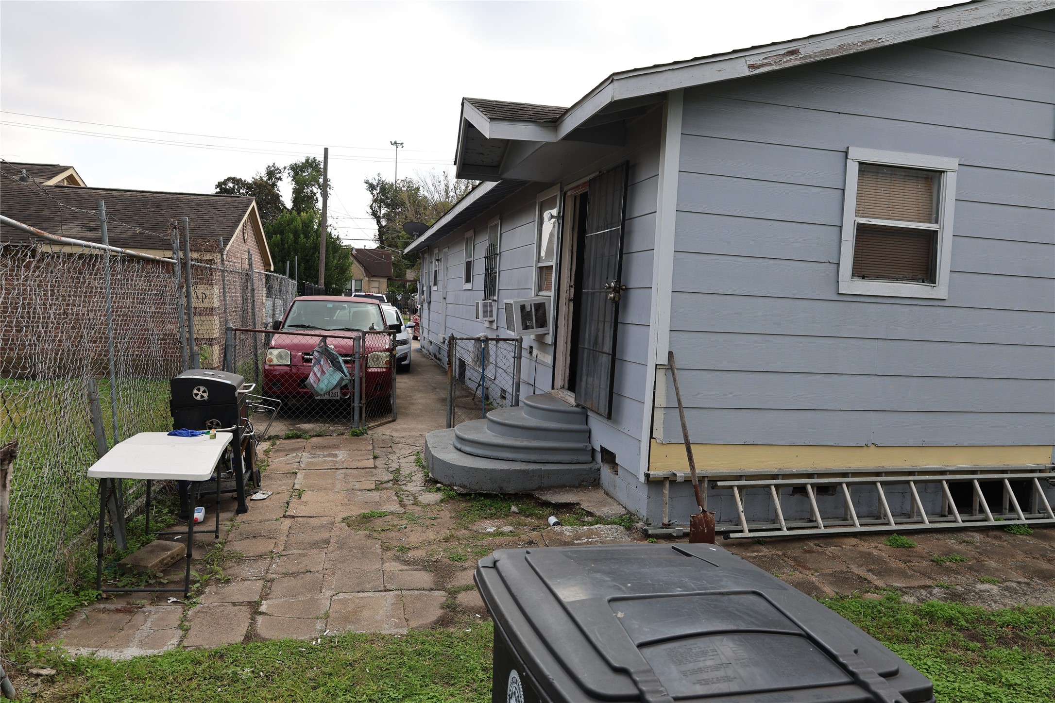 1009 Caplin Street Houston, TX 77022 - Photo 24 of 24 a view of a patio with table and chairs and potted plants