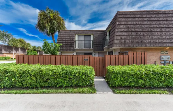 a backyard of a house with a garden