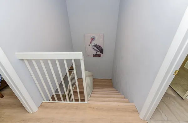 a view of a hallway with staircase