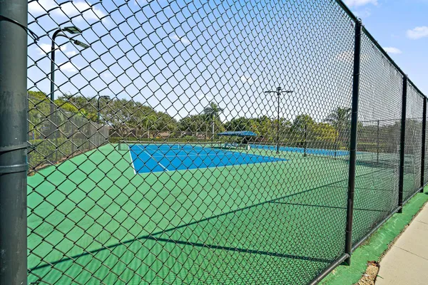 a view of a yard and a fence